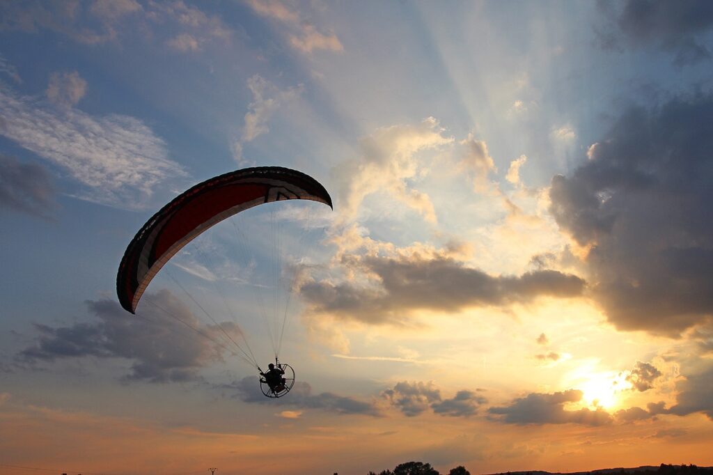 Motor Glider lands with sunset