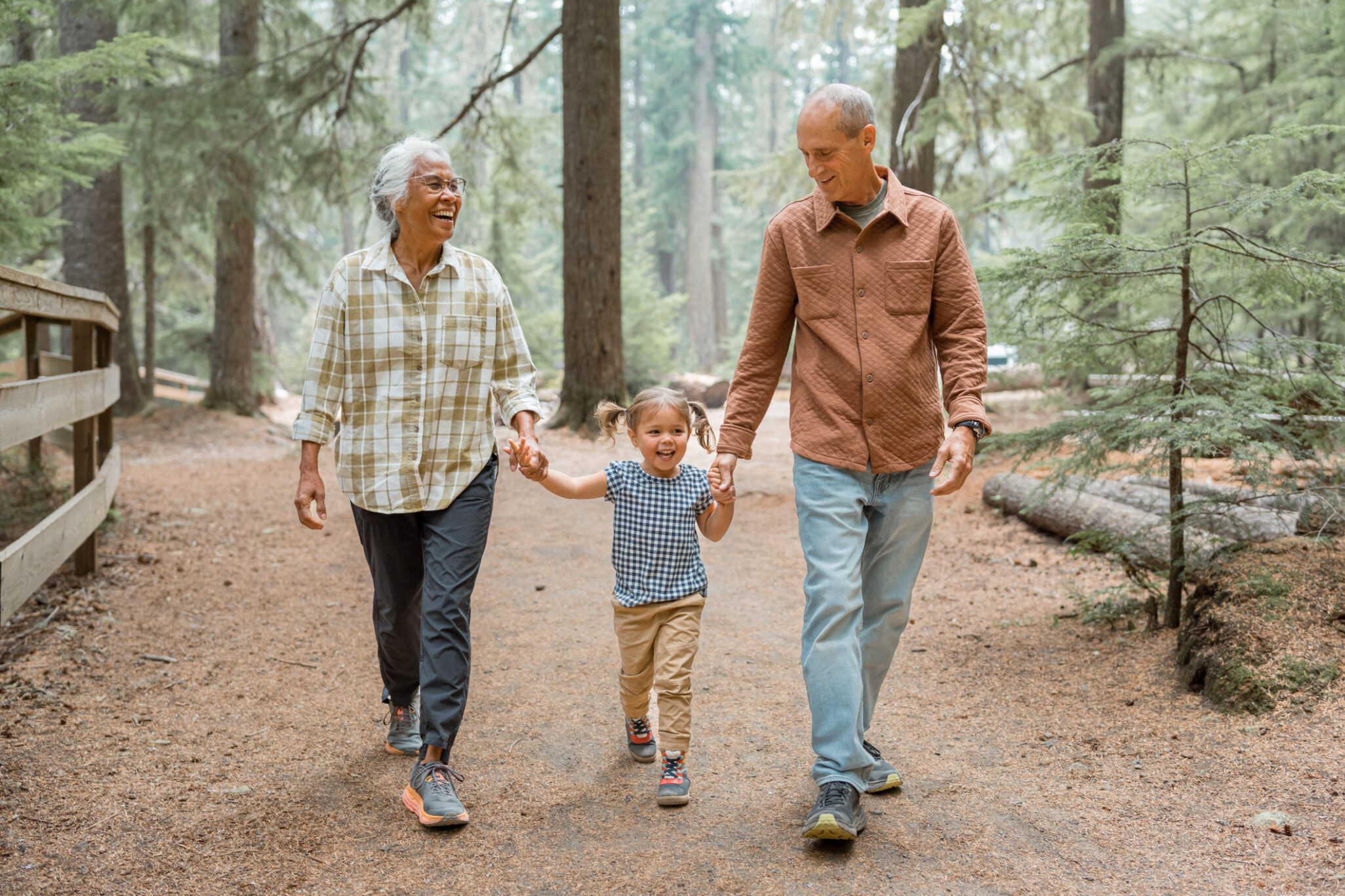 Vibrant multiracial senior couple hiking with their young granddaughter Estate Planning for Family