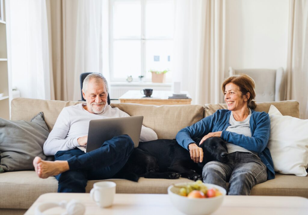 Couple on couch with dog